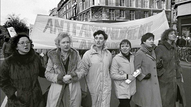 <p>Jacky Ardagh, Mary Holland, Ann-Marie Hourihane, Evelyn Conlon, an unidentified activist, and Inez McCormack walk side-by-side in Anti-Amendment march on 13 November 13, 1982.  Picture: Derek Speirs</p>