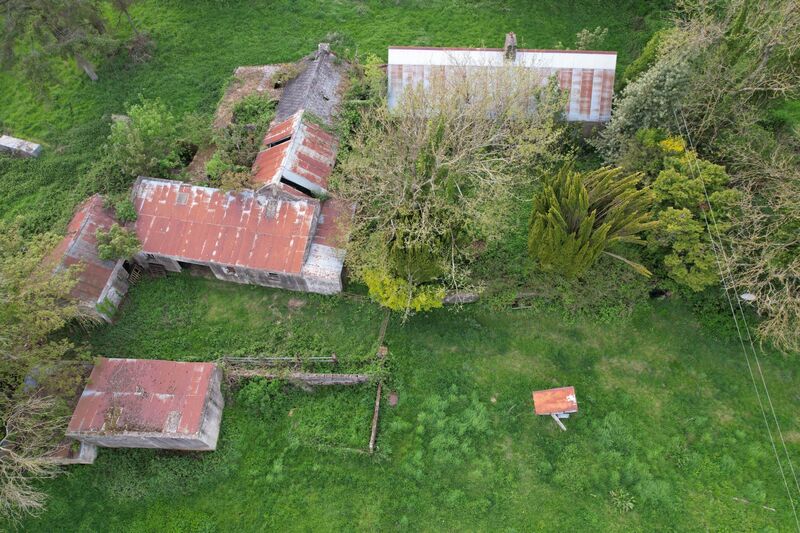 As well as the original farmhouse (in need of complete refurbishment), the outbuildings include a hay barn with an attached lean-to structure and ancillary out-offices.