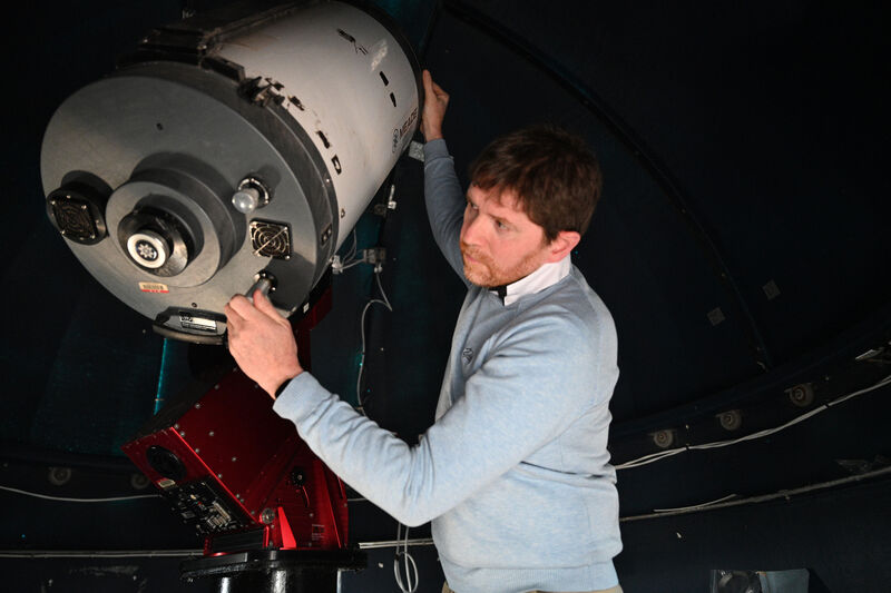 Alan Gilinan setting up their largest telescope. 
