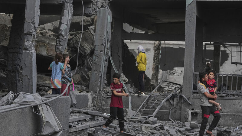Israeli strike kills 14 Palestinians including women and children in Gaza camp