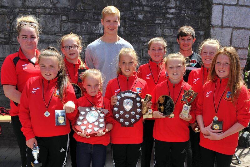 Members of the hugely successful Ringmahon Rangers U12 girls team who won the U12 Premier Division pictured with their coach Lyndsey Horgan, Caoimhin Kelleher and John Kavanagh 