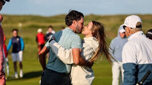<p>Fota Island's David Howard celebrates with his girlfriend Gabby Koumrack after sealing victory on Sunday in the East of Ireland Men's Amateur Open at Baltray. Pic: Bryan Keane, Inpho</p>