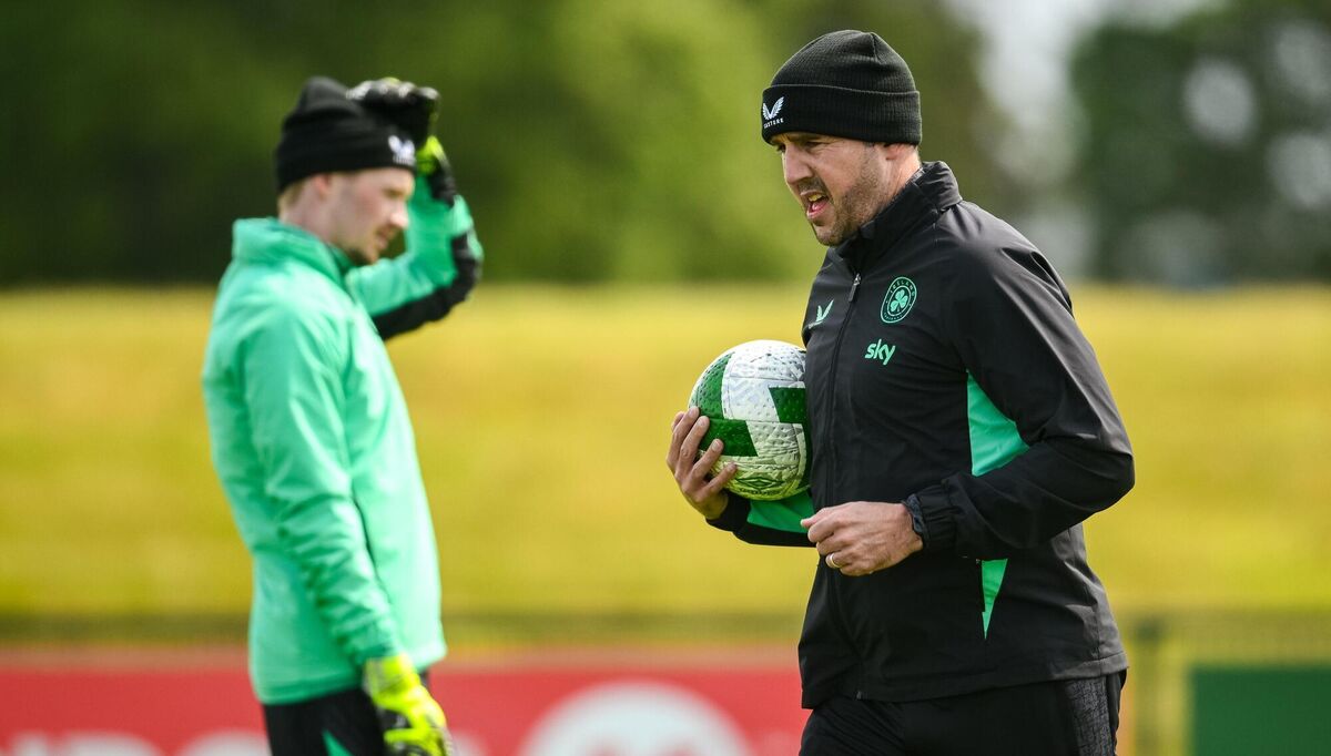Assistant head coach John O'Shea, right, and goalkeeper Caoimhin Kelleher. Pic: Ramsey Cardy/Sportsfile