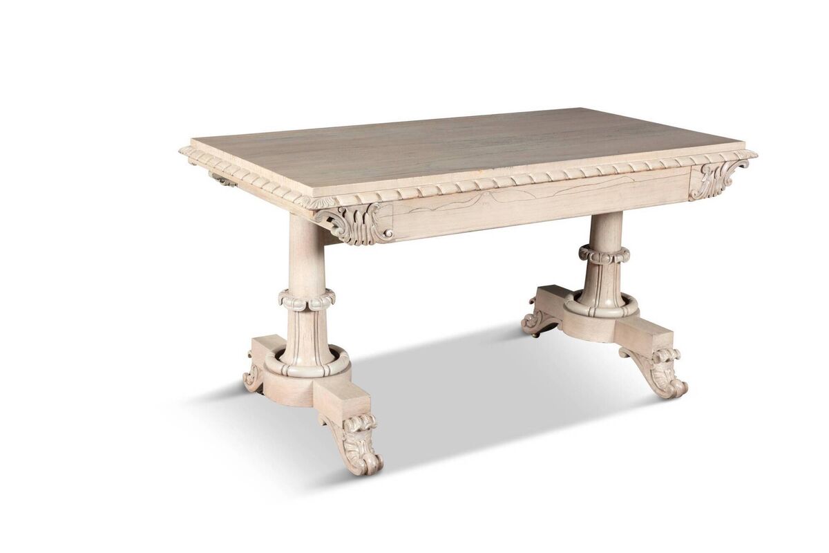 A bleached timber library table at James Adam.