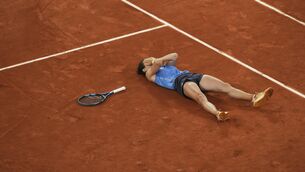 <p>Lois Boisson celebrates her latest stunning win (Christophe Ena/AP)</p>