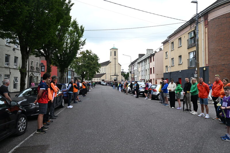 The guard of honour by local running and swimming clubs after the funeral mass for Ellen Cassidy today. Picture: Larry Cummins The guard of honour by local running and swimming clubs after the funeral mass for Ellen Cassidy today. Picture: Larry Cummins