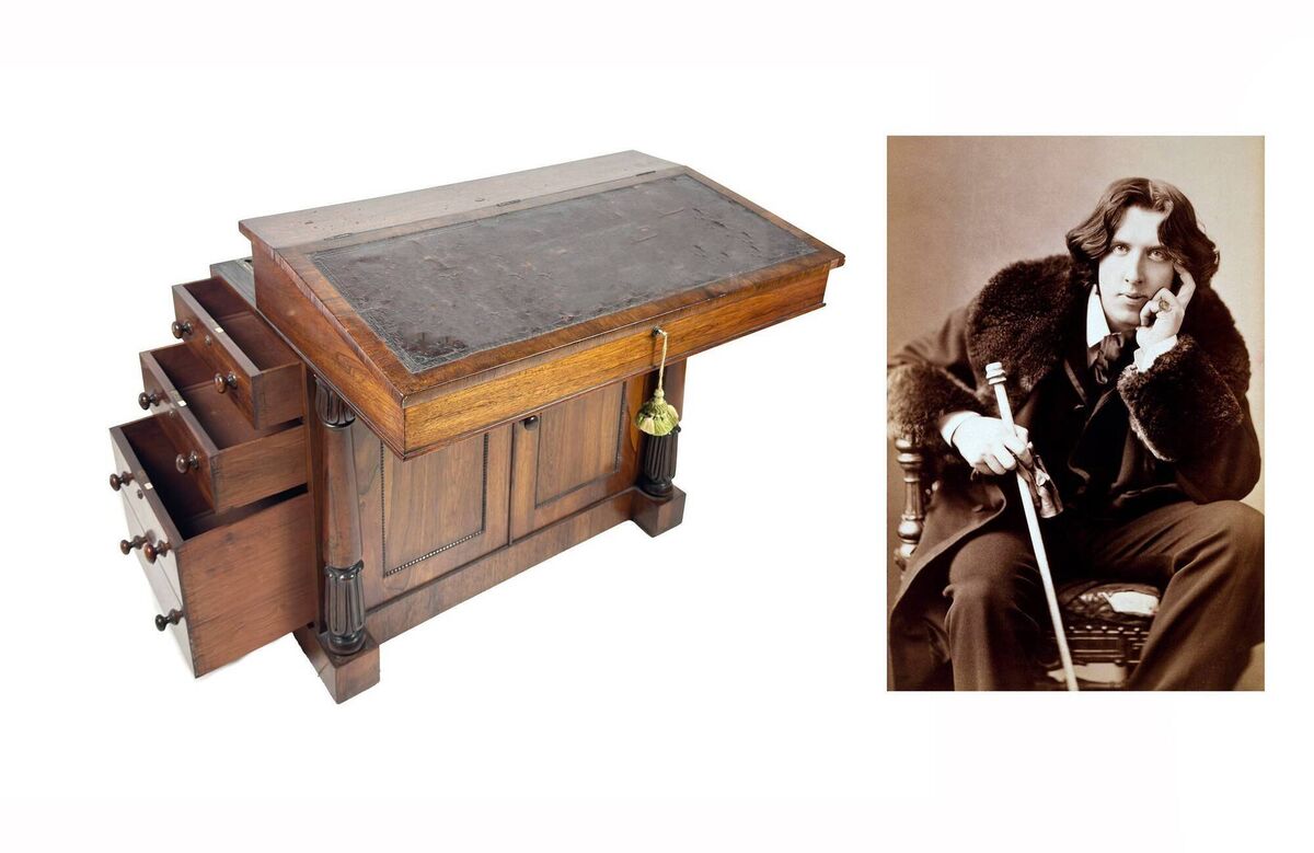 The oversized slope-front desk used by Oscar Wilde. Inset, a photo of the author, poet and playwright. 
