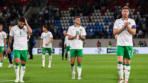 <p>Ireland’s Ryan Manning, Jack Taylor and Nathan Collins applaud the travelling fans after the game</p>