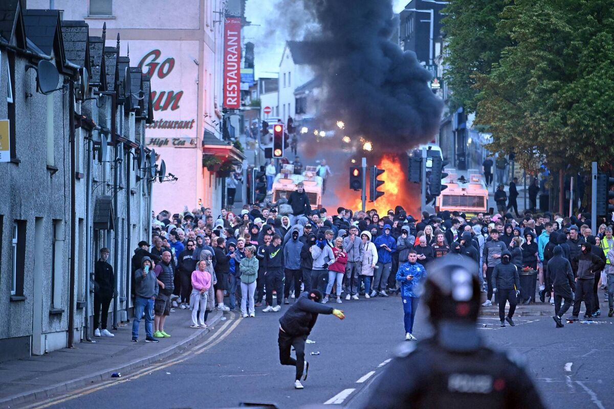 Police have come under attack for a second night in Ballymena, County Antrim as racially motivated rioters set fire to property and launched fireworks and missiles at police lines. 