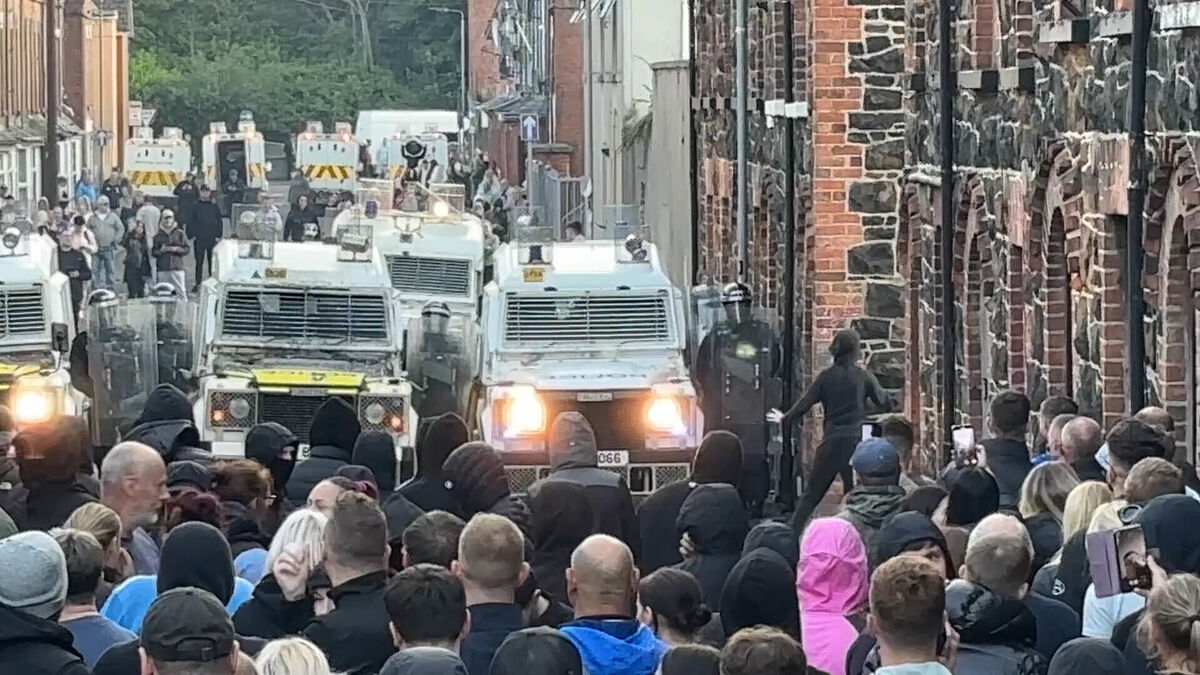 PSNI vehicles forming a barricade at Clonavon Terrace, Ballymena, as people take part in a protest over an alleged sexual assault in the Co Antrim town. Picture: Niall Carson/PA Wire