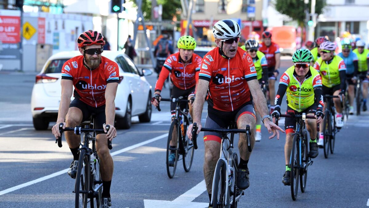 Olympic rower Gary O'Donovan and cycling legend Seán Kelly lead cyclists down Grand Parade at the start of the 2023 Tour De Munster. Picture: Don MacMonagle Olympic rower Gary O'Donovan and cycling legend Seán Kelly lead cyclists down Grand Parade at the start of the 2023 Tour De Munster. Picture: Don MacMonagle