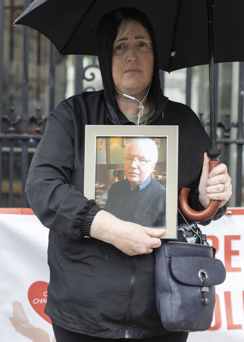 
                        Tracy Smith holds a picture of her late father Damien, who was a resident of Benevin Nursing Home, Dublin: 'My dad couldn’t get his voice heard, and now I stand here, I am his voice today.' 