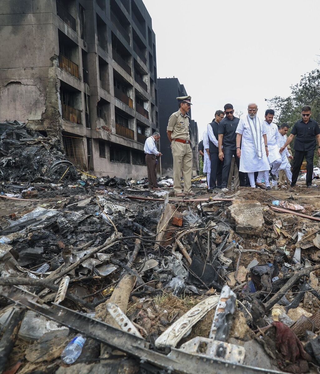 Indian Prime Minister Narendra Modi inspecting the site of a plane crash in the northwestern Indian city of Ahmedabad, in Gujarat state, Friday, June 13, 2025. (Prime Minister Narendra Modi on X via AP)