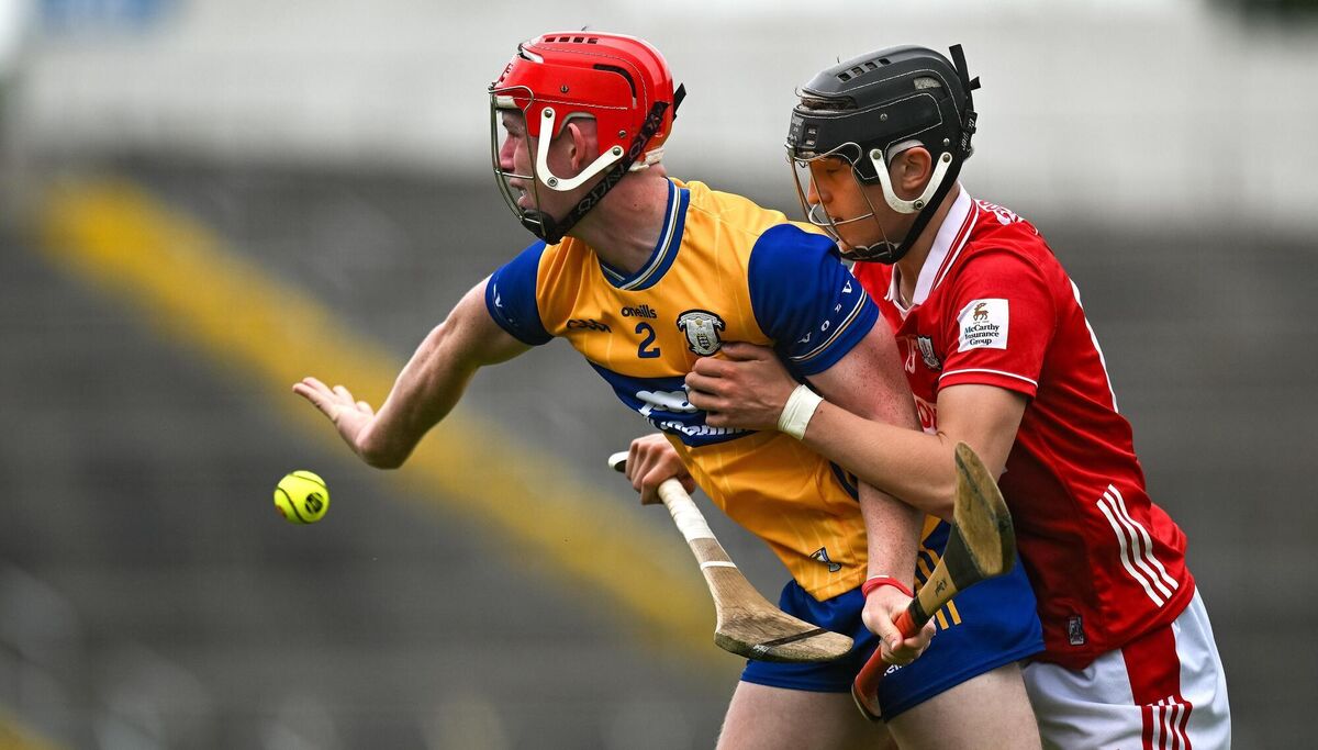 CLASSY CLARE: Niall Doyle of Clare in action against Sam Ring of Cork. Pic: Brendan Moran/Sportsfile.