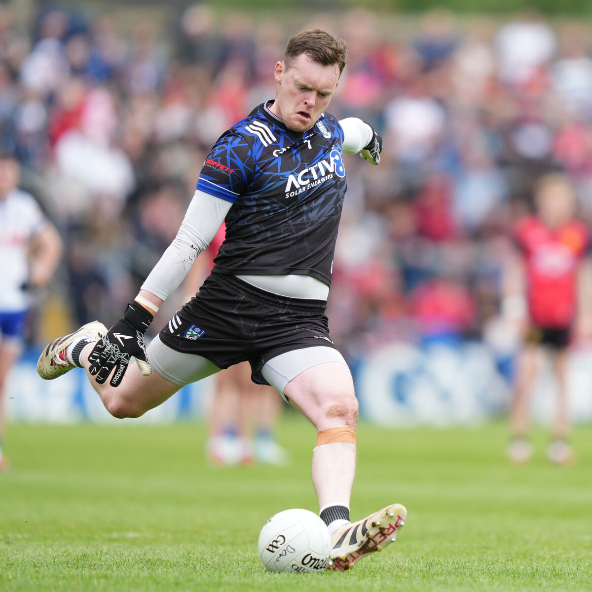 Rory Beggan of Monaghan kicks his second 2 pointer of the game. Pic: ©INPHO/James Lawlor.