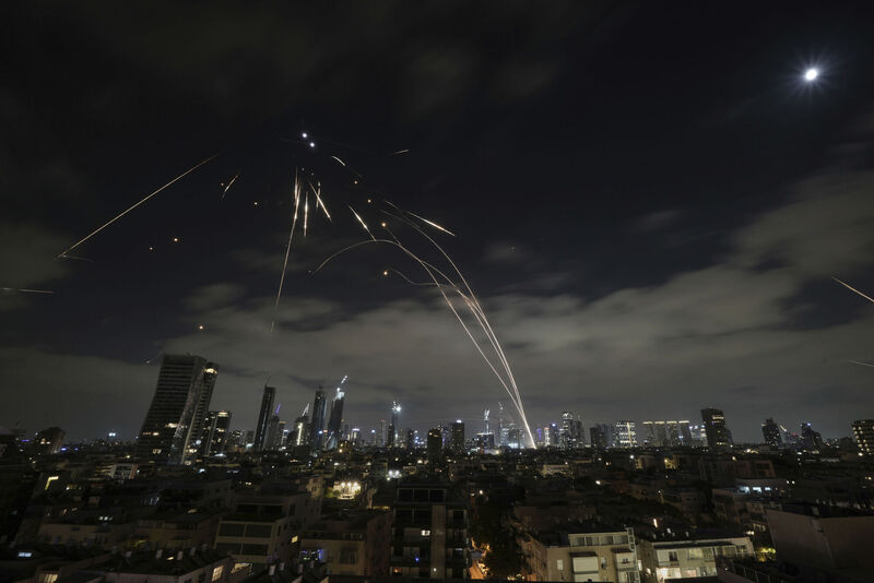 The Israeli Iron Dome air defense system fires to intercept missiles during an Iranian attack over Tel Aviv, Israel, Sunday, June 15, 2025. (AP Photo/Leo Correa)