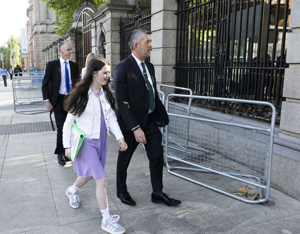 
                        Cara Darmody is escorted by Sinn Féin Maurice Quinlivan as she arrives at Leinster House to address the Oireachtas committee on disability matters. Picture: Sam Boal/Collins