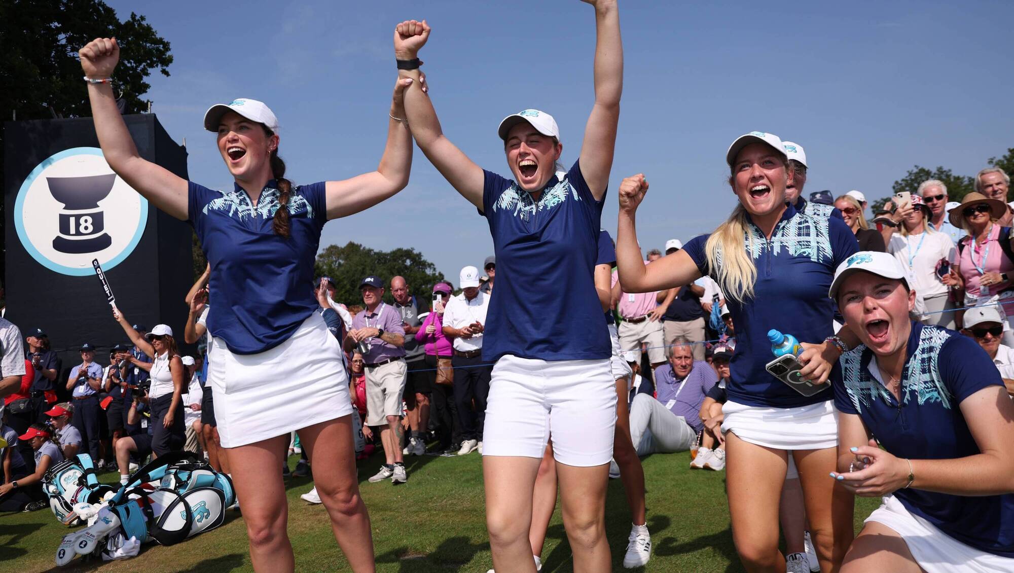 Aine Donegan, Hannah Darling, Sara Byrne, and Beth Coulter celebrate Great Britain & Ireland's victory during the Sunday Singles on Match Day Three of the Curtis Cup at Sunningdale Golf Club. Pic: Oisin Keniry/R&A/R&A via Getty Images. 