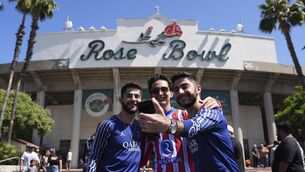 <p>Soccer fans take a photo outside the Rose Bowl stadium prior to the Club World Cup group B soccer match between PSG and Atletico Madrid in Pasadena, Calif., Sunday, June 15, 2025. (AP Photo/Jae Hong)</p>