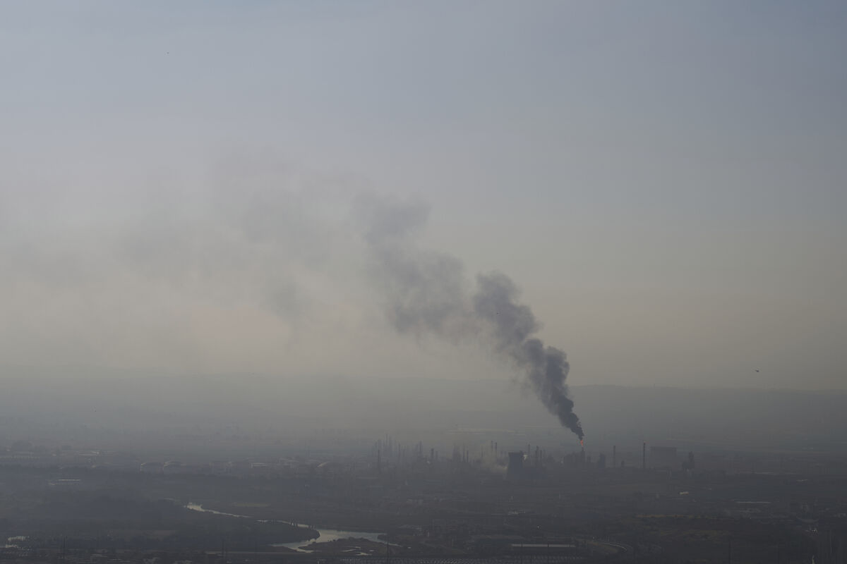Smoke billows after an Iranian missile struck an oil refinery in Haifa, northern Israel, early Monday, June 16, 2025. Picture: AP Photo/Ariel Schalit Smoke billows after an Iranian missile struck an oil refinery in Haifa, northern Israel, early Monday, June 16, 2025. Picture: AP Photo/Ariel Schalit