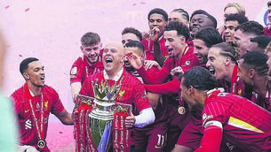 <p>Liverpool manager Arne Slot lifts the Premier League trophy at Anfield in May. Can they do it all over again in 2025/26?</p>