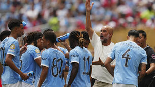 <p>Manchester City manager Pep Guardiola says Rico Lewis’ red card was ‘unnecessary’ by the referee (Derik Hamilton/AP)</p>