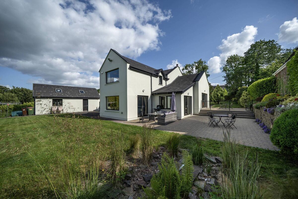 Expansive rear lawn and patio area