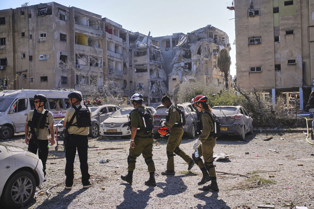 Israeli security forces arrive to inspect a destroyed building that was hit by a missile fired from Iran, in Holon, near Tel Aviv, Israel, Thursday, June 19, 2025. (AP Photo/Ohad Zwigenberg) Israeli security forces arrive to inspect a destroyed building that was hit by a missile fired from Iran, in Holon, near Tel Aviv, Israel, Thursday, June 19, 2025. (AP Photo/Ohad Zwigenberg)