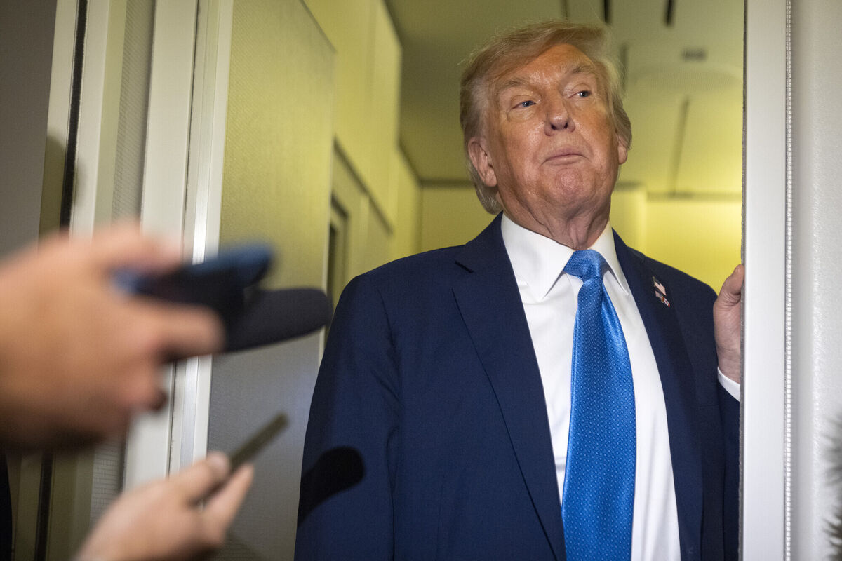 President Donald Trump speaks with reporters while flying aboard Air Force One. (AP Photo/Mark Schiefelbein) President Donald Trump speaks with reporters while flying aboard Air Force One. (AP Photo/Mark Schiefelbein)