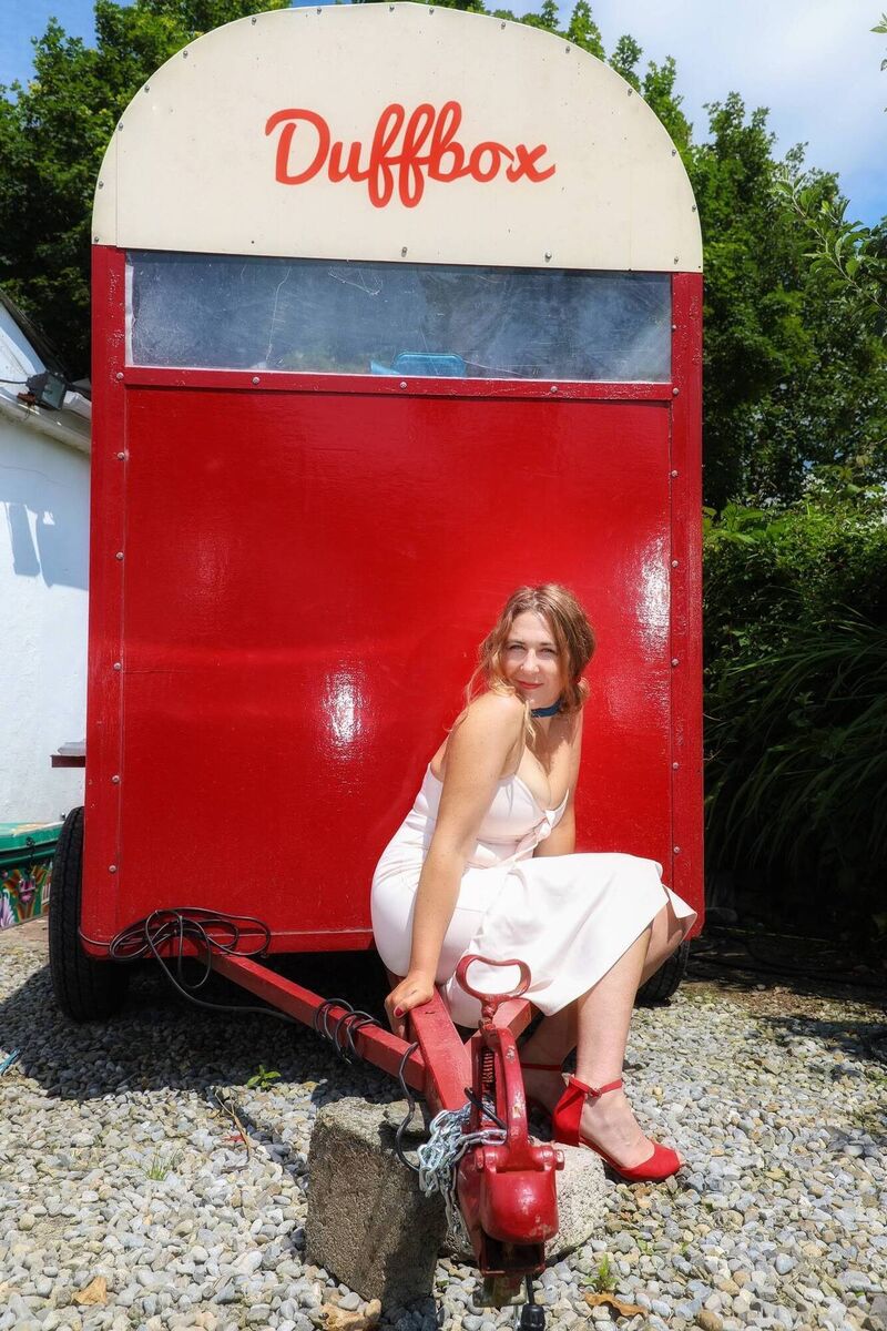 Áine Duffy at her mobile gig venue, a converted donkey box, in 2021.