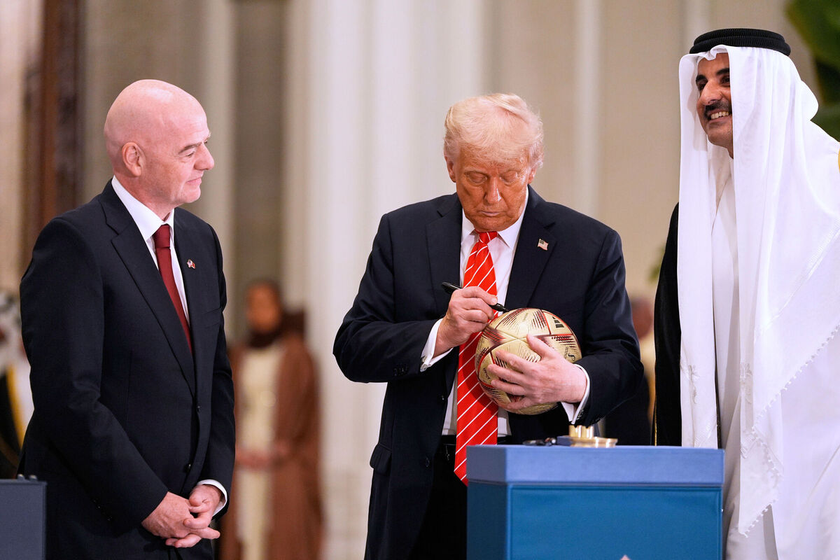 THE COMPANY YOU KEEP: President Donald Trump signs a FIFA soccer ball as Qatar's Emir Sheikh Tamim bin Hamad Al Thani and FIFA President Gianni Infantino looks on at the Lusail Palace, Wednesday, May 14, 2025, in Doha, Qatar, as they marked the passing of World Cup hosting duties from Qatar, which held it in 2022, to the United States, which is hosting in 2026. (AP Photo/Alex Brandon)