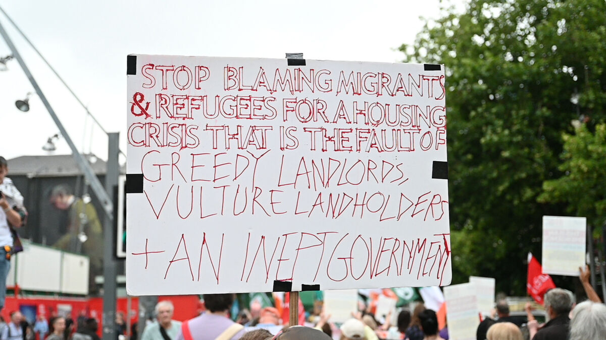 STOP BLAMING MIGRANTS poster at the Raise the Roof protest march against government housing policy at Grand Parade Cork City on Saturday afternoon. Picture: Larry Cummins STOP BLAMING MIGRANTS poster at the Raise the Roof protest march against government housing policy at Grand Parade Cork City on Saturday afternoon. Picture: Larry Cummins