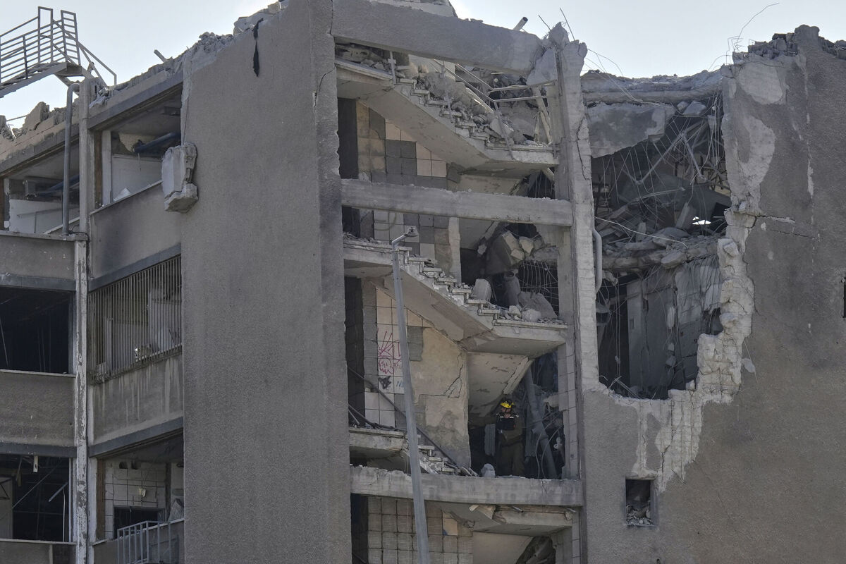 Israeli emergency teams work in an unpopulated building after it was hit by a missile fired from Iran, in Haifa, Israel, Friday, June 20, 2025. Picture: AP Photo/Baz Ratner