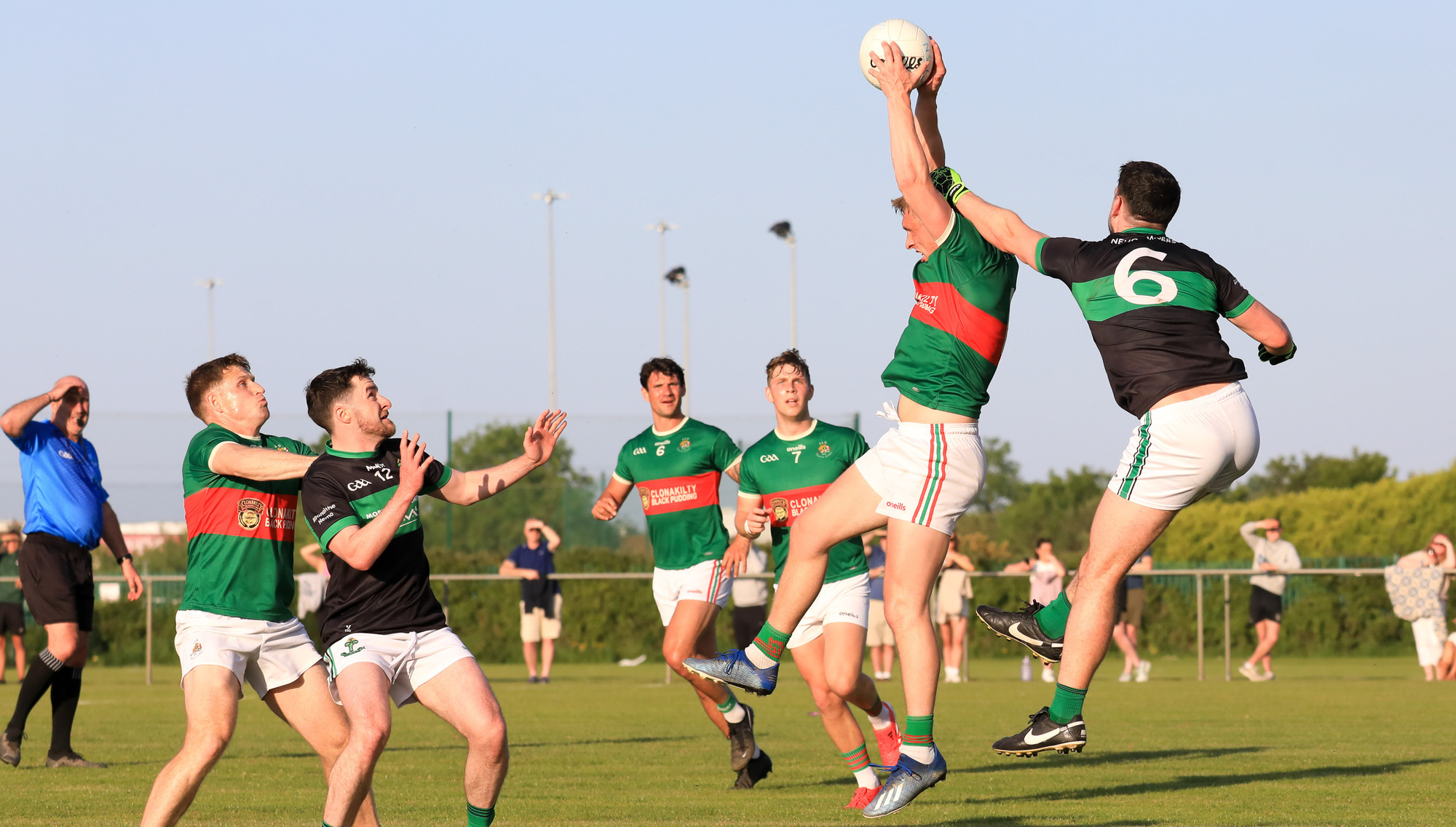 Clon's Sean White takes a high ball against Nemo's Kevin Fulignati. Pic: David Creedon