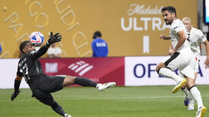 <p>Ilkay Gundogan (right) scored twice as Manchester City thrashed Al Ain 6-0. Pic: Brynn Anderson/AP</p>