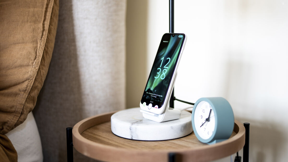 The Aurora A30 is charging on the optional wireless dock. Picture: Doro.
