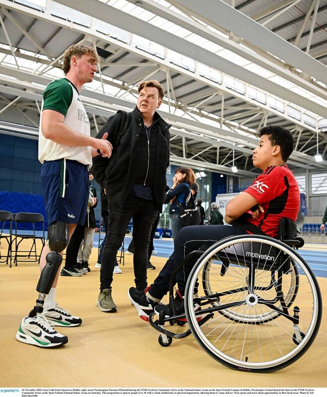 Sean Codd from Glasnevin, Dublin, right, meets Paralympian Tiarnán O'Donnell during the PTSB NextGen Community Series at the National Indoor Arena on the Sport Ireland Campus in Dublin. Picture Seb Daly/Sportsfile 