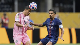 <p>Inter Miami's Luis Suarez, left, heads the ball as Paris Saint-Germain's Marquinhos closes in during the Club World Cup round of 16 soccer match between PSG and Inter Miami in Atlanta, Sunday, June 29, 2025. (AP Photo/Mike Stewart)</p>
