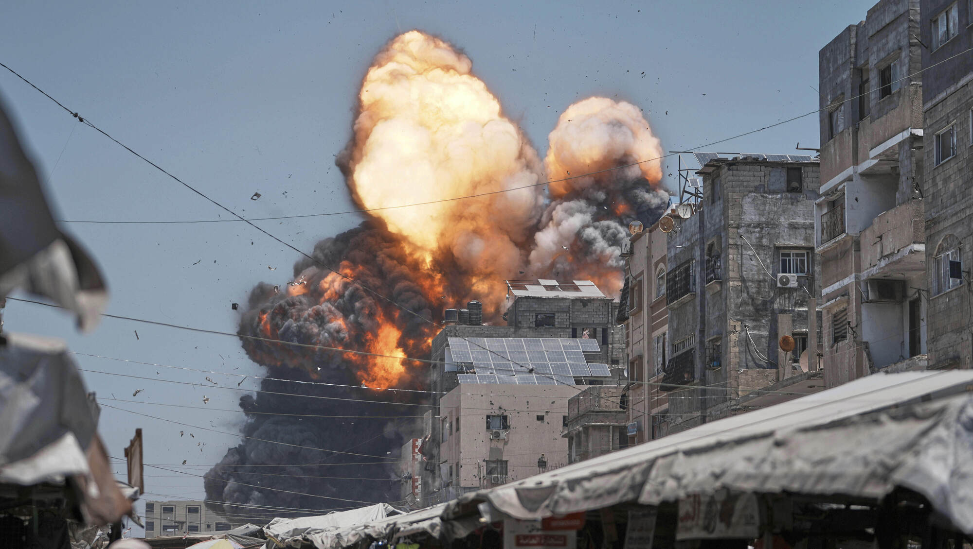 74 killed in Gaza as Israeli forces strike cafe and fire on people seeking food