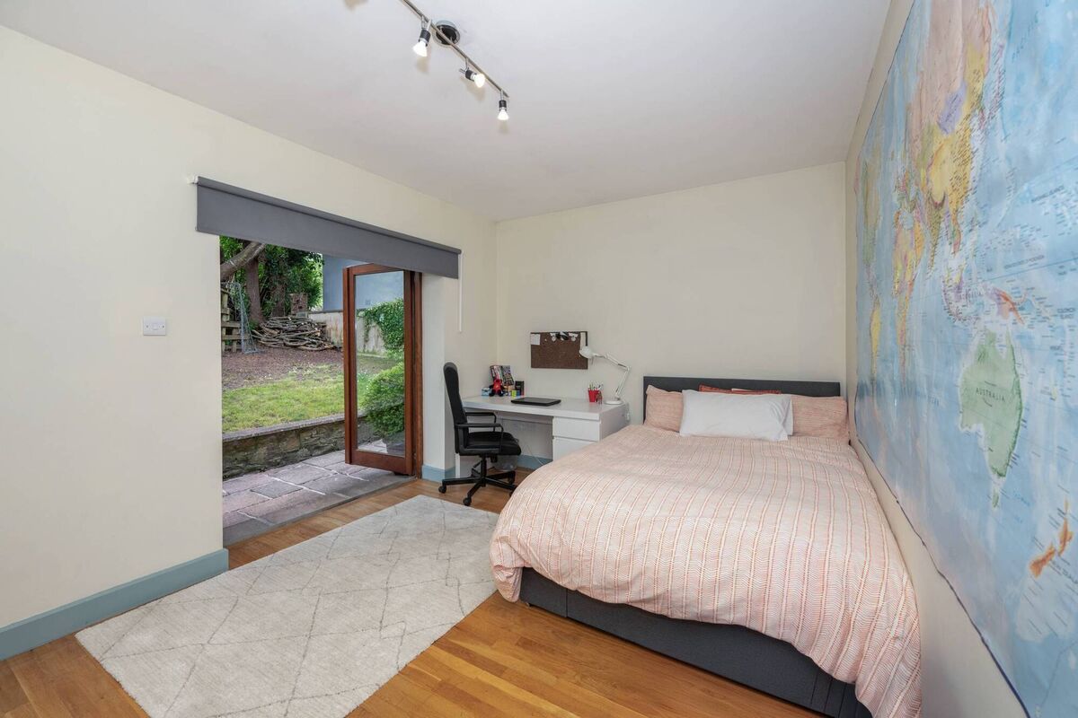 Downstairs bedroom with patio doors