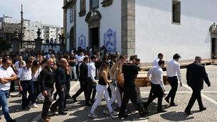 <p>Diogo Jota’s wife Rute Cardoso walks with the coffin after the funeral of Diogo Jota and Andre Silva. Pic: PA</p>