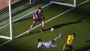 <p>Real Madrid's Kylian Mbappe, bottom, scores his side's 3rd goal during the Club World Cup quarterfinal soccer match between Real Madrid and Borussia Dortmund in East Rutherford, N.J., Saturday, July 5, 2025. (AP Photo/Pamela Smith)</p>