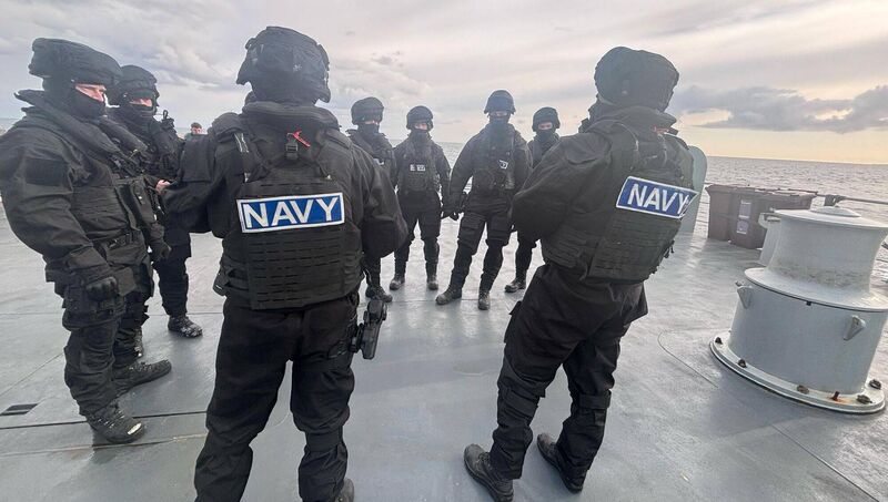 A Maritime Interdiction Team (MIT) receiving a briefing at sea. Picture: Gardaí