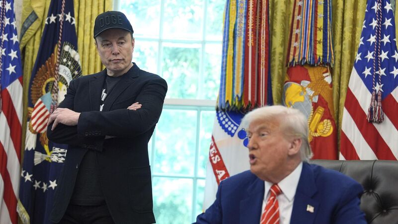 Elon Musk listens as President Donald Trump speaks during a news conference in the Oval Office of the White House, Friday, May 30, 2025, in Washington. (AP Photo/Evan Vucci)