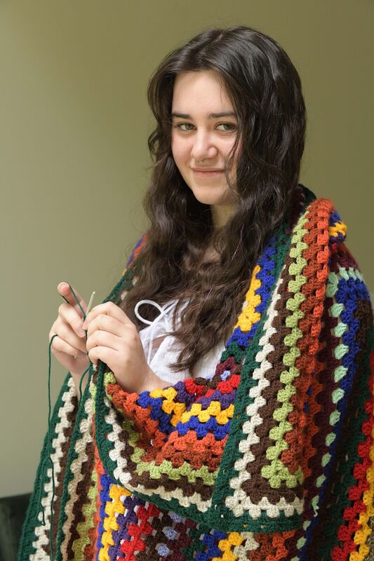  Holly Browne working on a multicoloured blanket. Photograph Moya Nolan.