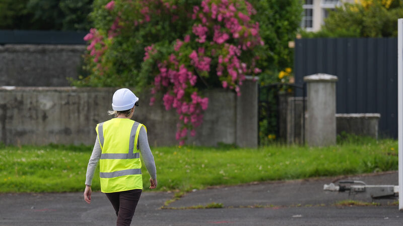 An excavation worker on site during a press preview, ahead of the excavation at St Mary's home for unmarried mothers and their children which was run by the Bon Secours Sisters, a religious order of Catholic nuns in Tuam in Co Galway. The excavation will try to identify the remains of infants who died at the home between 1925 and 1961. An excavation worker on site during a press preview, ahead of the excavation at St Mary's home for unmarried mothers and their children which was run by the Bon Secours Sisters, a religious order of Catholic nuns in Tuam in Co Galway. The excavation will try to identify the remains of infants who died at the home between 1925 and 1961.