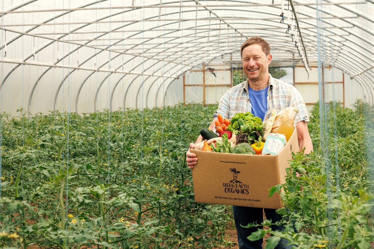 Kenneth Keavey, of Green Earth Organics, holding his Summer Essentials box