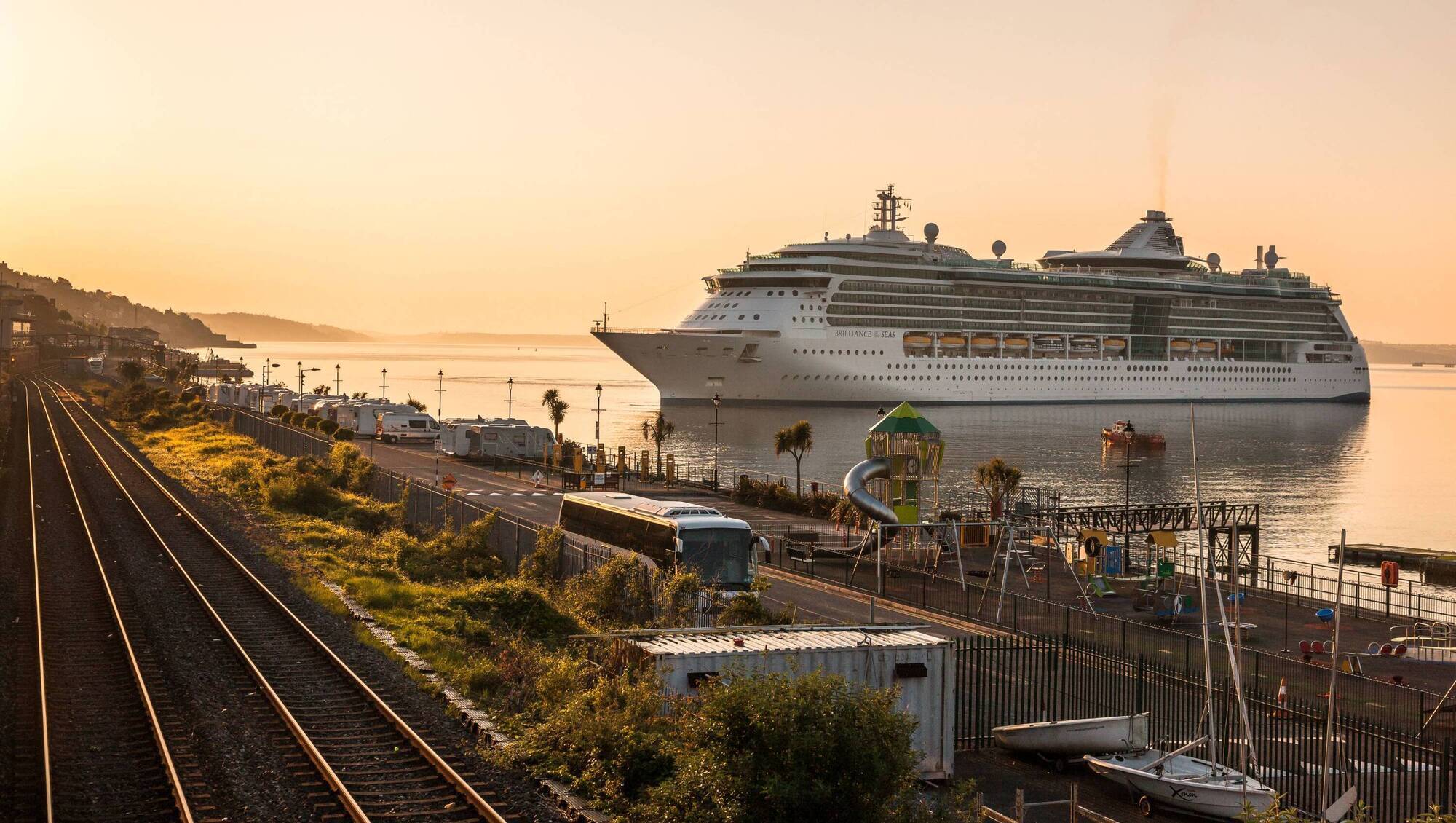 Campervans parked in Cobh, with a view of the harbour and a cruise liner. Picture David Creedon / Anzenberger