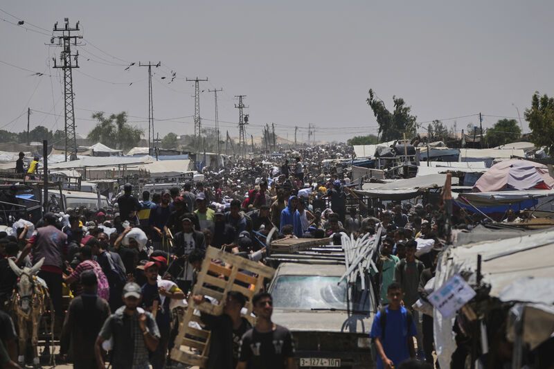 Palestinians heading to receive food and humanitarian aid packages from the Gaza Humanitarian Foundation, a U.S.-backed organization, in Rafah, southern Gaza Strip, Monday, June 9, 2025. (AP Photo/Abdel Kareem Hana)