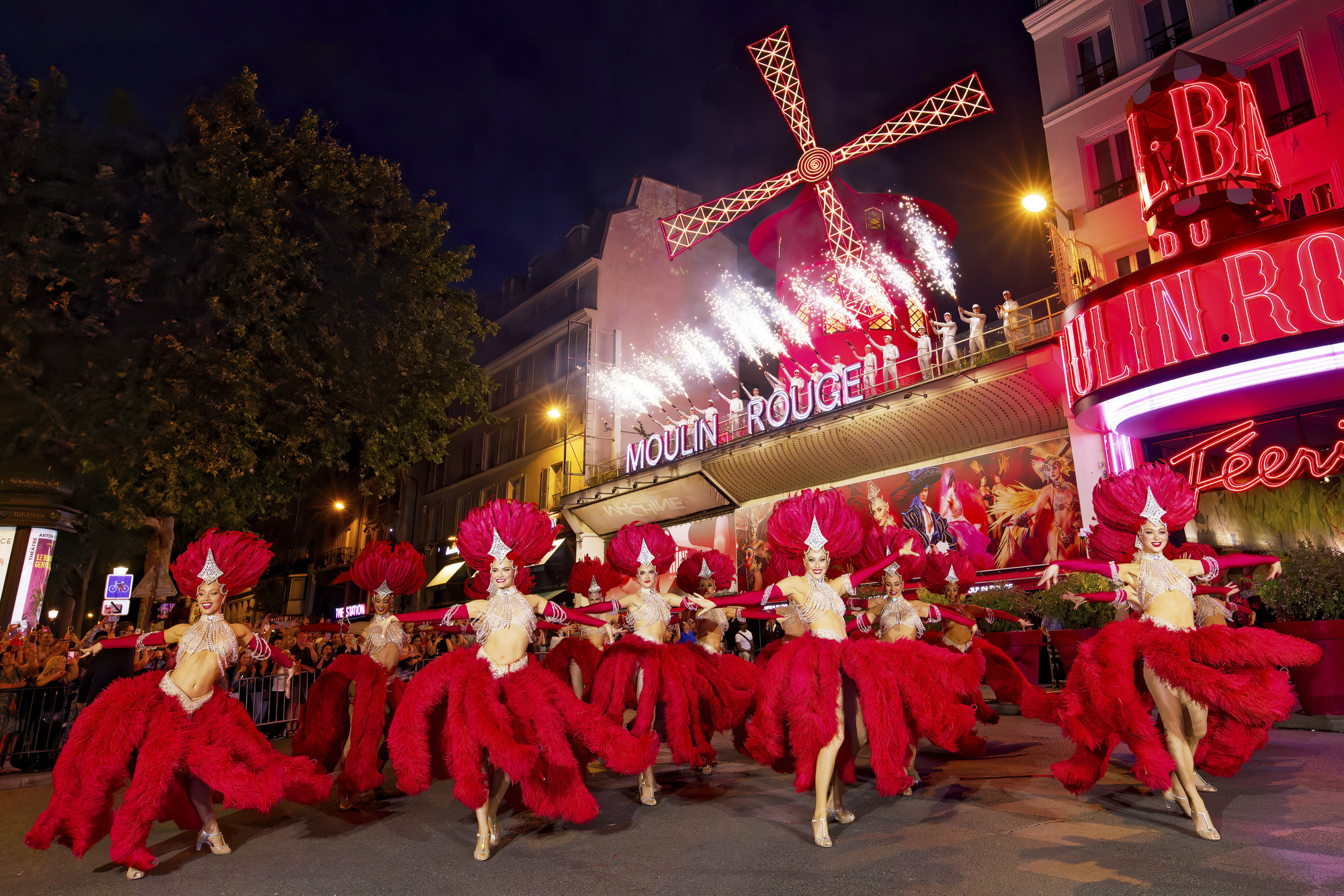 Moulin Rouge’s windmill sails turn again after restoration